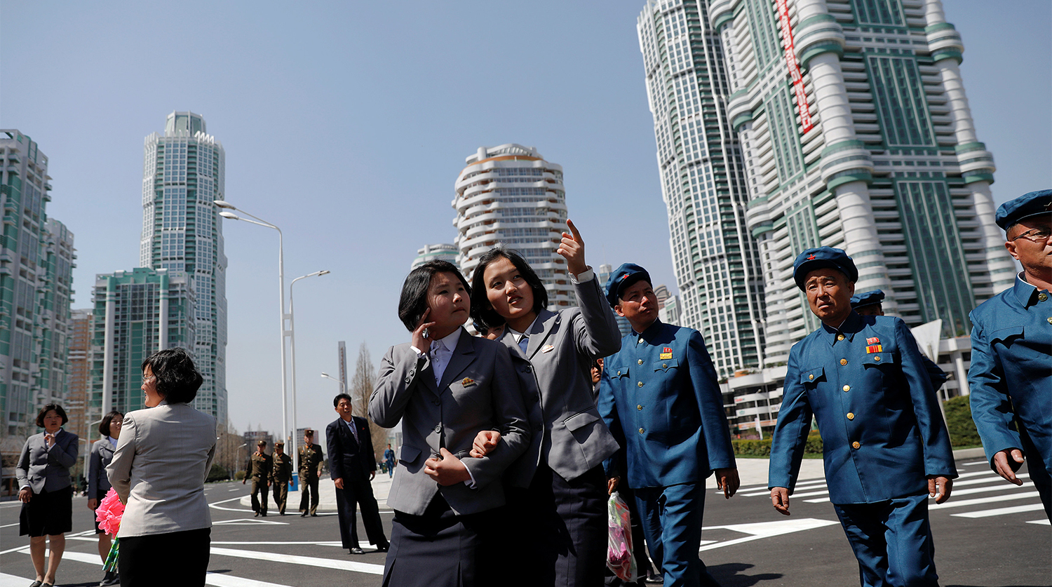 People check the newly constructed residential complex after its opening ceremony in Ryomyong street in Pyongyang